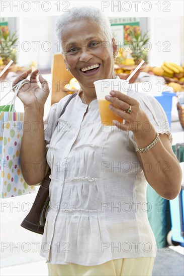 African American woman drinking juice