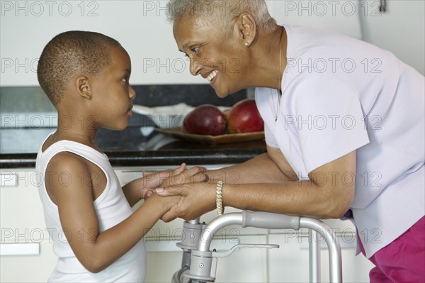 African American grandmother holding hands with grandson