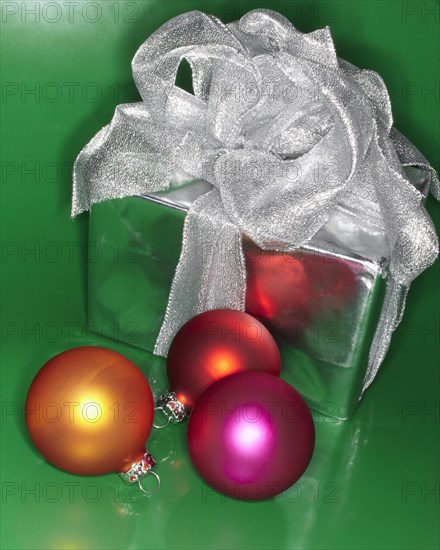 Festive Christmas gift with colored ornaments