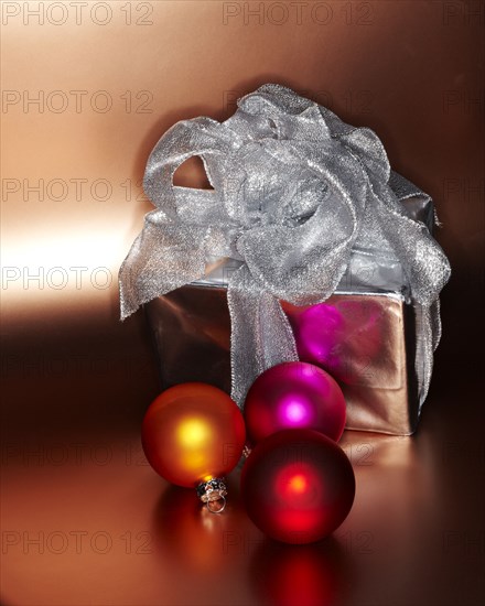 Festive Christmas gift with colored ornaments