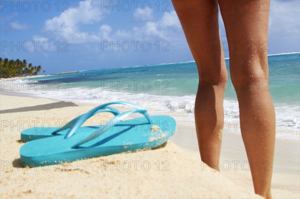 Caucasian woman standing on beach