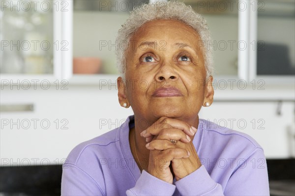 African American woman praying