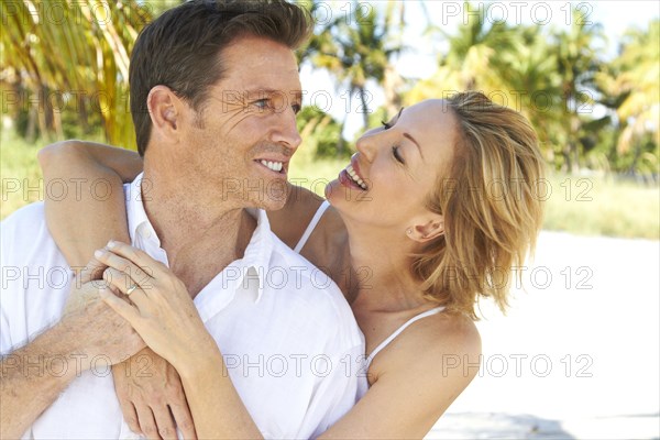 Caucasian couple hugging outdoors