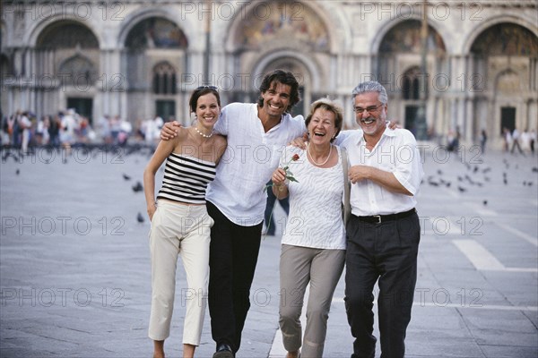 Couples walking together in St. Mark's Square