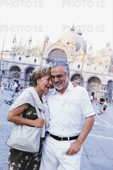 Senior couple hugging in St. Mark's Square