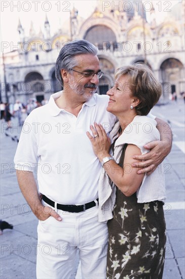 Senior couple hugging in St. Mark's Square