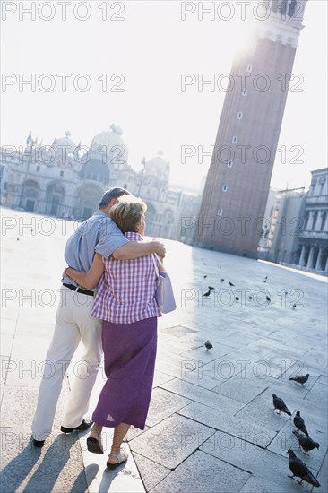 Senior couple hugging in St. Mark's Square