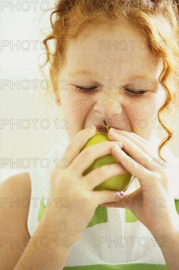 Girl eating apple