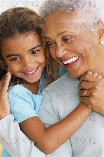 Senior woman and granddaughter touching noses
