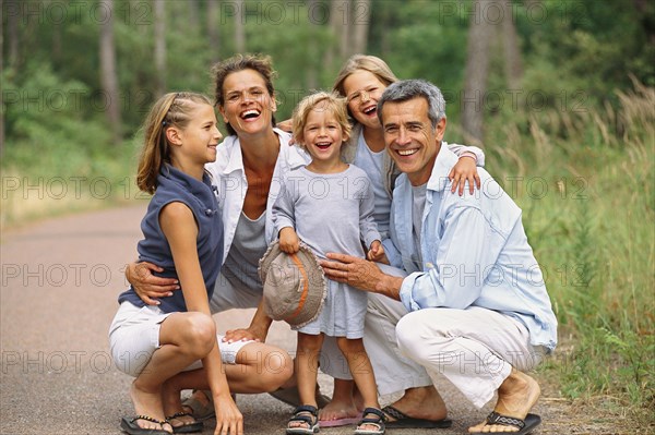 Caucasian family smiling in park