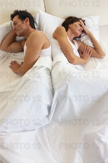 Couple arguing in bed