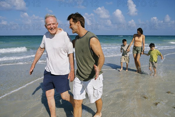 Family walking together on beach