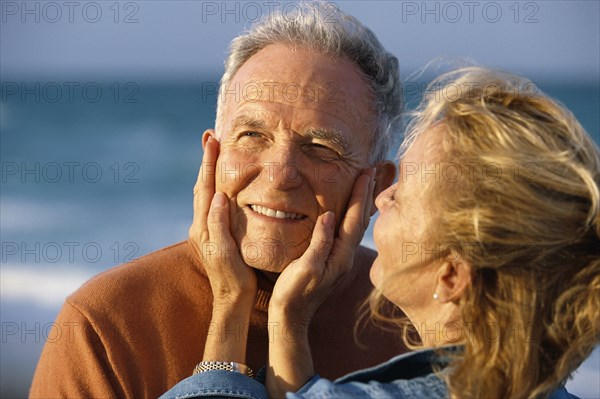 Senior couple relaxing on beach