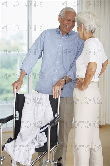 Senior couple smiling in hospital