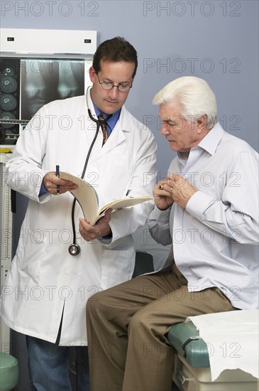 Doctor talking to patient in hospital room