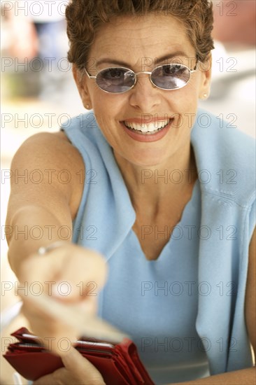 Senior woman paying with credit card