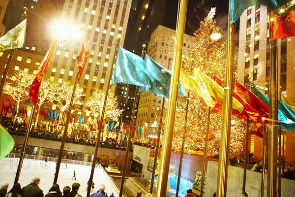 Flags flying over Rockefeller Center at night