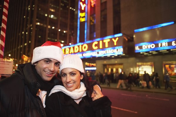 Couple smiling outside Radio City Hall