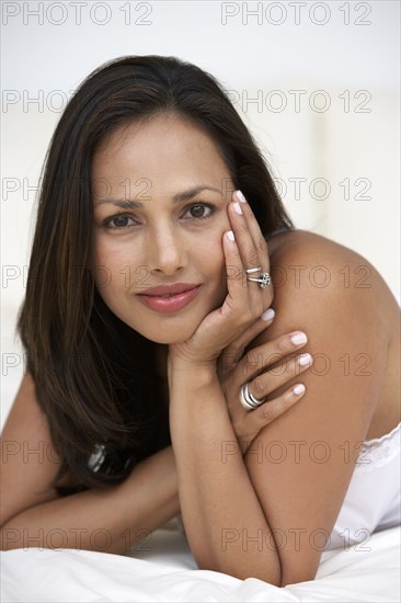 Indian woman laying on bed