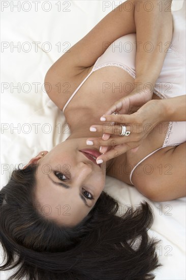 Indian woman laying on bed