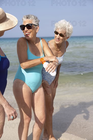 Senior women walking on beach