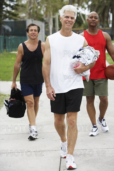 Senior men walking on court