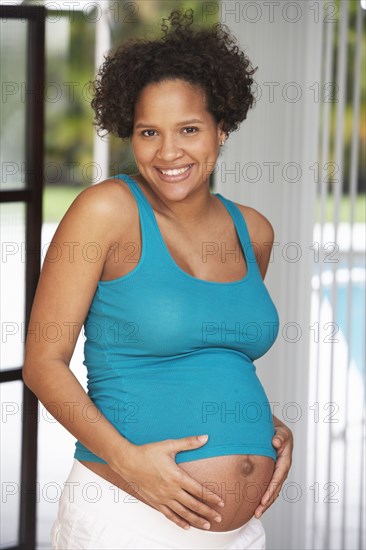 Pregnant woman holding her belly