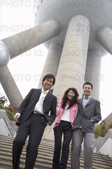 Chinese business people under Oriental Pearl Tower