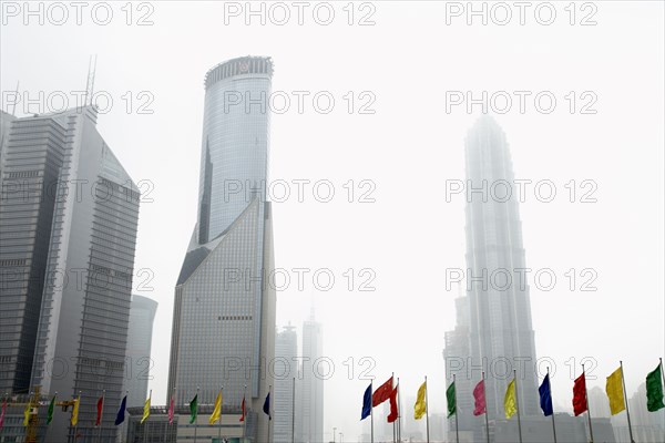 Colorful flags and urban skyscrapers