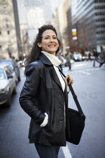 Woman smiling on city street