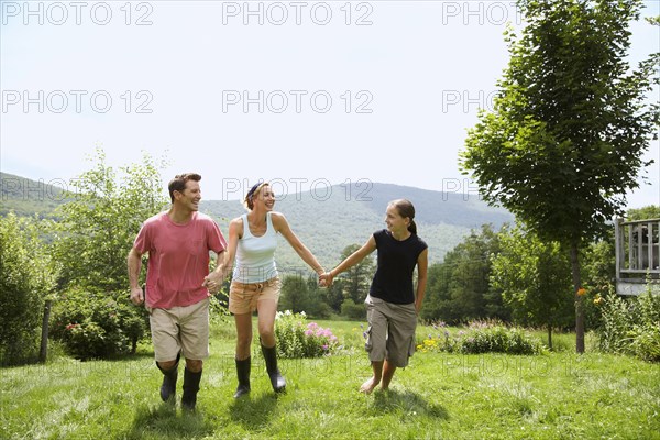 Family walking together in backyard