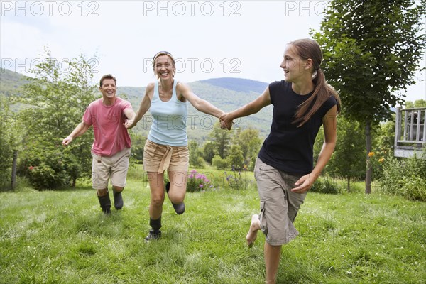 Family walking together in backyard