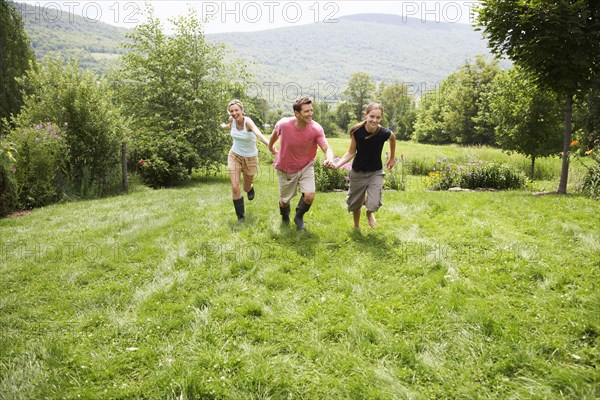 Family walking together in backyard