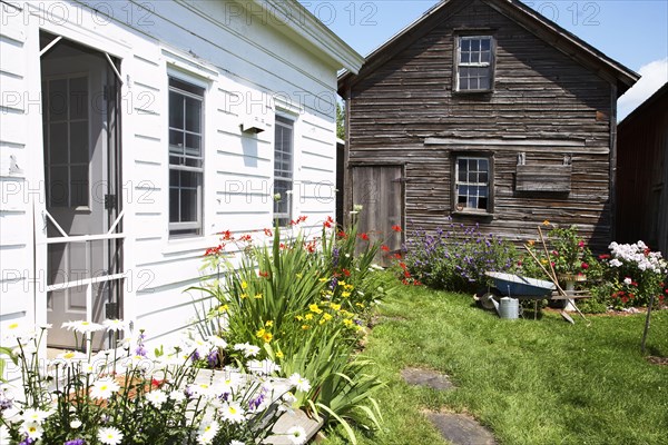 Shed and flowerbeds in backyard