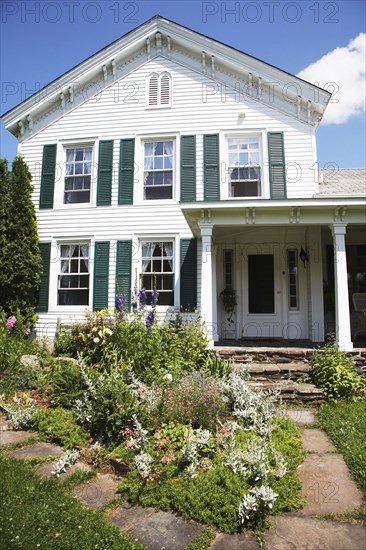 Flowerbeds outside suburban house