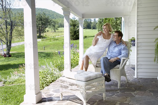 Couple relaxing together on patio