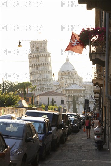 View of the Leaning Tower of Pisa from city street