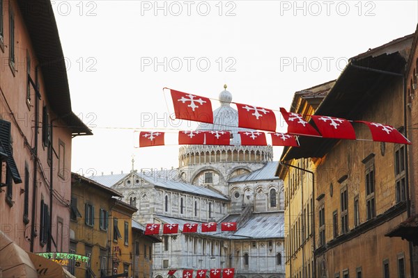 Flags flying over city street