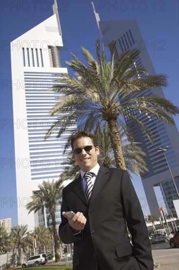 Caucasian businessman using cell phone