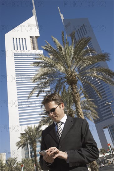 Caucasian businessman using cell phone