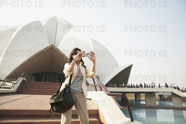 Caucasian tourist taking pictures at Bahai Temple