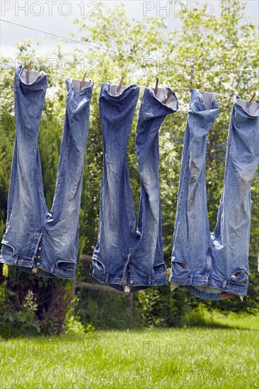 Jeans hanging from clothesline