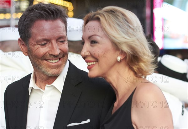 Caucasian couple talking in Times Square