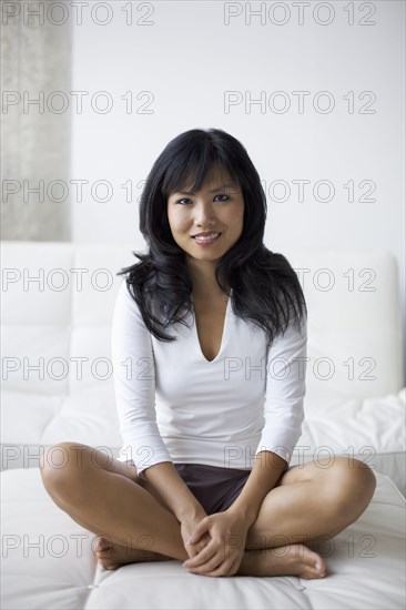 Smiling woman sitting in living room