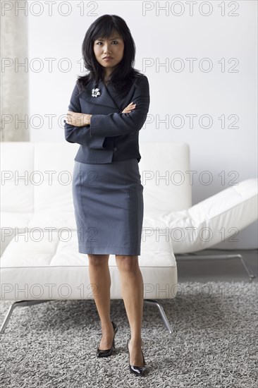 Serious businesswoman with arms crossed