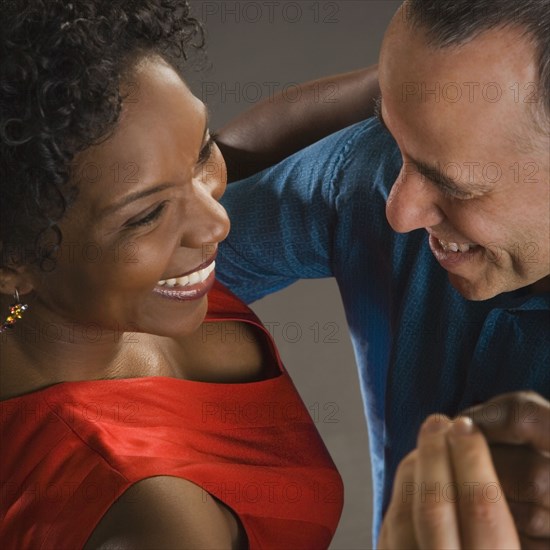 Multi-ethnic couple dancing