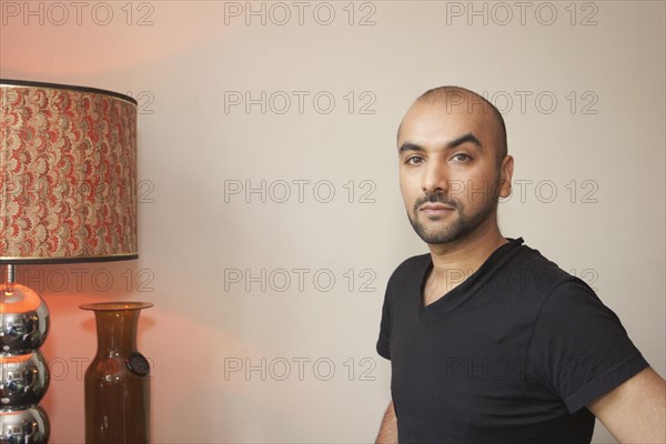 Mixed race man in living room