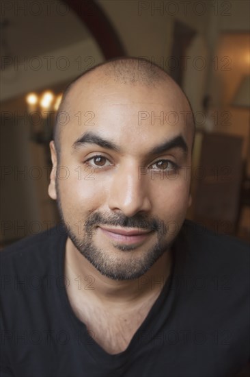 Close up of smiling mixed race man