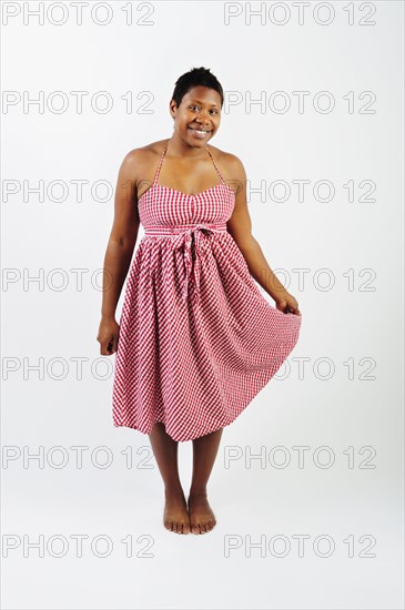 African woman wearing checkered dress