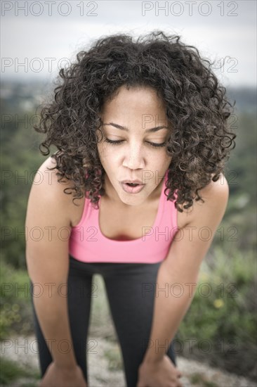 Tired woman resting after exercise